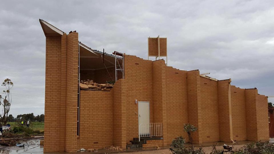 Sturdy building with parts of its wall caved in and roof gone in Blyth. Image Credit: Michelle Morris