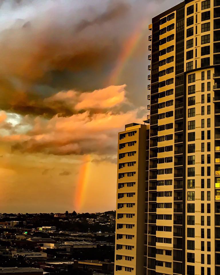Sunset and rainbow after the storm at Bowen Hills via Jodi Zolek-Jones