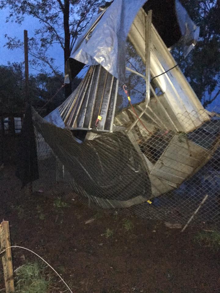 Debris (what looks to be metal sheeting) twisted around fencing and trees in Parkes via Rodney Ross